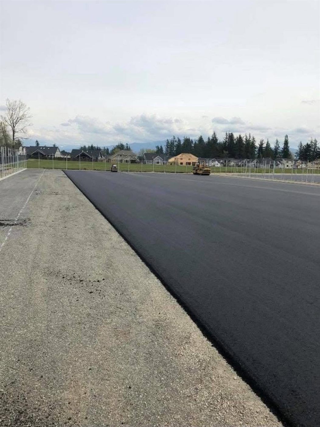 Fresh commercial asphalt with mountains on the horizon